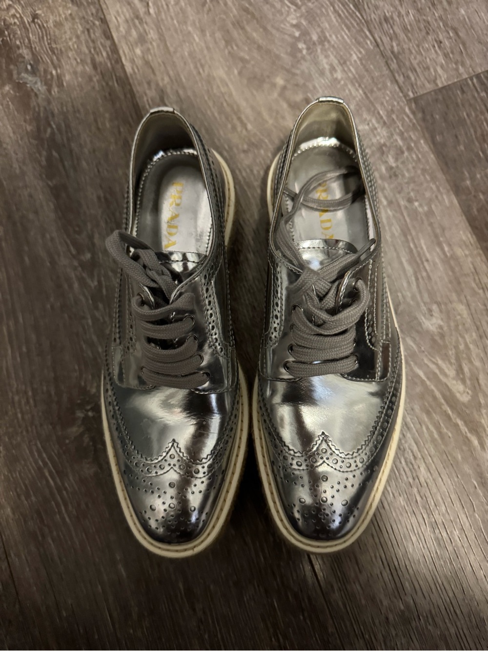 Prada Metallic Silver Wingtip Flats